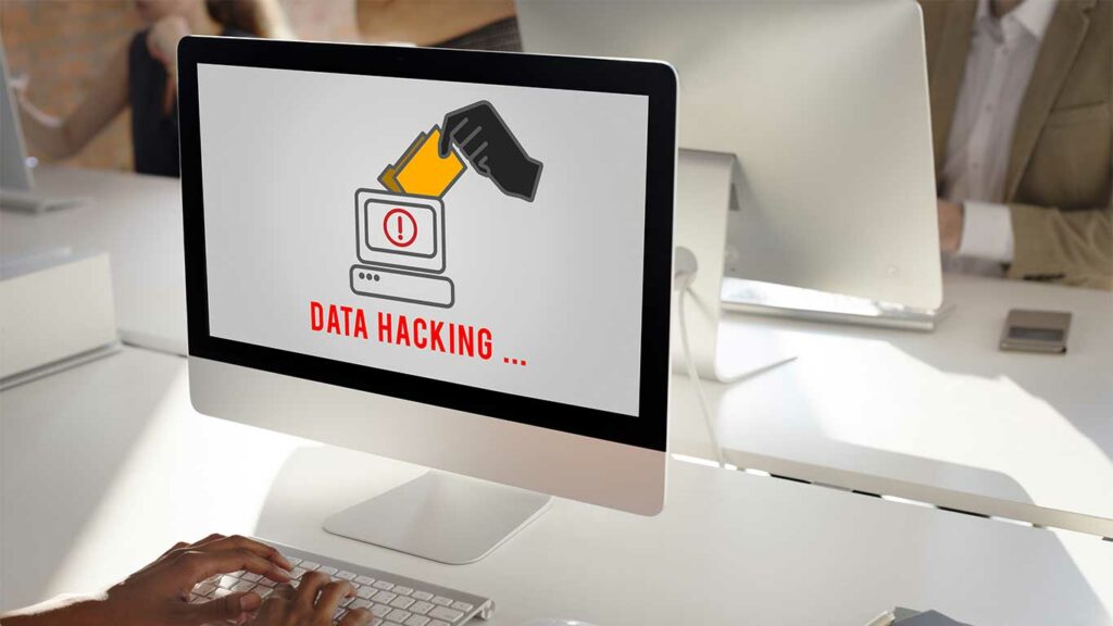 Image d'un ordinateur verrouillé avec un message de rançon affiché, représentant l'attaque de Ransomware, la technique de piratage préférée des hackers.